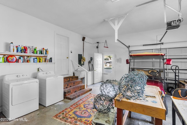 garage featuring electric panel, washer and dryer, a sink, and a garage door opener