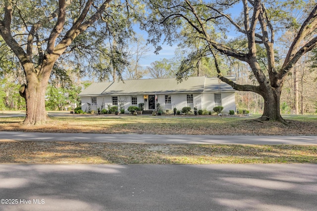 ranch-style house with a front lawn