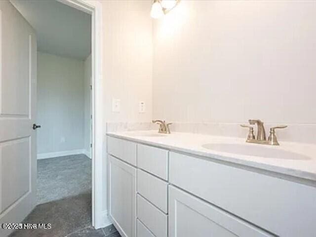 bathroom with double vanity and a sink