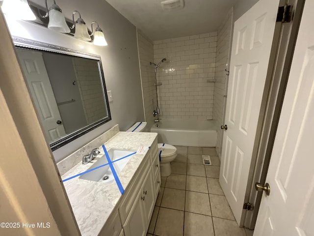 510 Sioux Dr, Jacksonville, NC 28540 - bathroom with tile patterned flooring, visible vents, toilet, vanity, and tub / shower combination