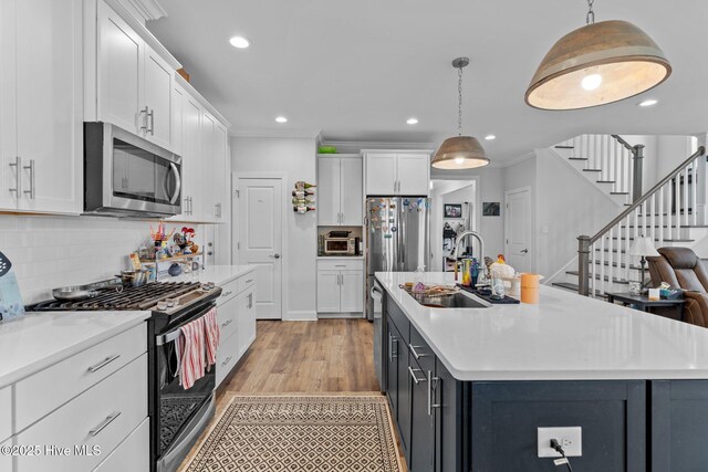 3763 Spicetree Dr, Wilmington, NC 28412 - kitchen featuring white cabinets, a sink, and appliances with stainless steel finishes