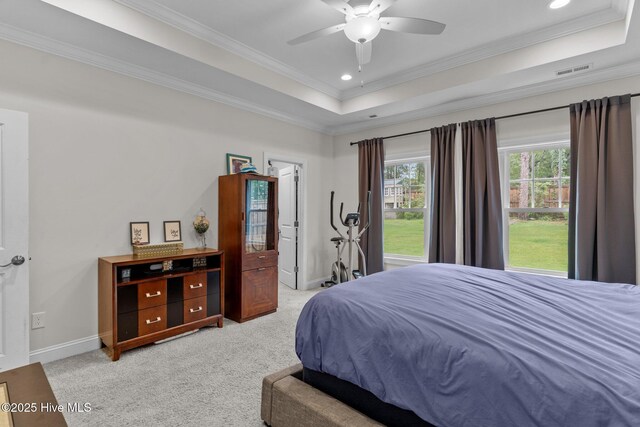 3763 Spicetree Dr, Wilmington, NC 28412 - bedroom with baseboards, ornamental molding, light carpet, visible vents, and a tray ceiling