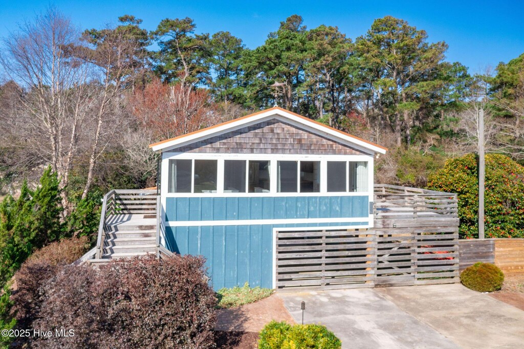 exterior space with driveway and fence