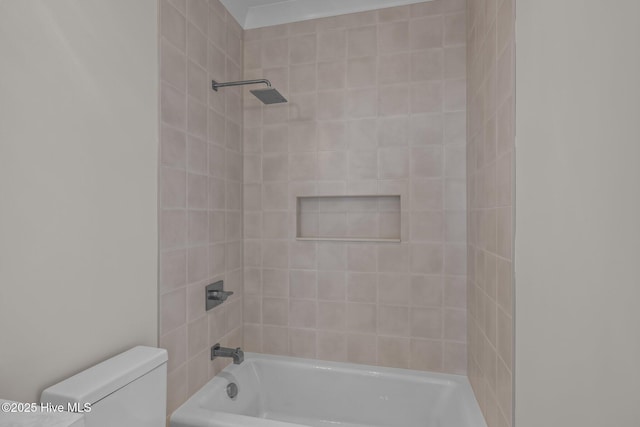 bathroom with toilet and shower / tub combination