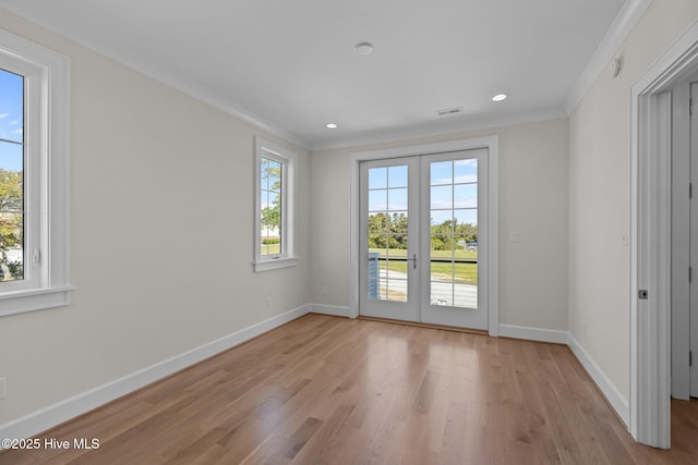 doorway to outside featuring light wood-style flooring, baseboards, ornamental molding, visible vents, and recessed lighting
