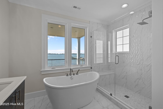 full bath featuring a marble finish shower, vanity, marble finish floor, a freestanding bath, and visible vents