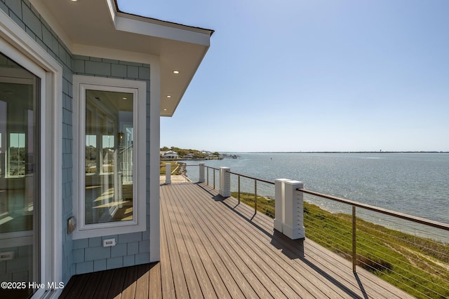 wooden deck with a water view
