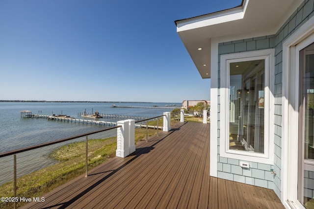 wooden deck featuring a water view
