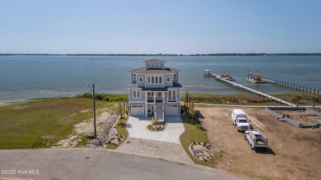 property view of water featuring stairway