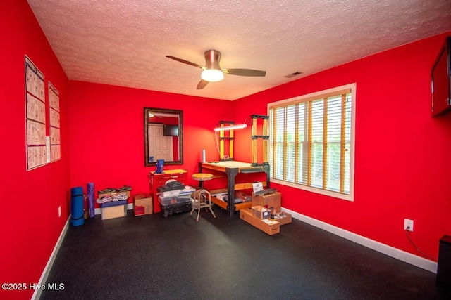 511 Pine Valley Dr, Morehead City, NC 28557 - miscellaneous room with a textured ceiling, ceiling fan, baseboards, and rubber floors