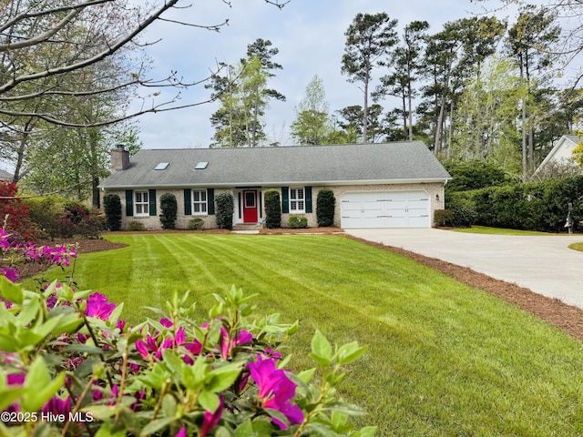 511 Pine Valley Dr, Morehead City, NC 28557 - view of front of house featuring concrete driveway, a garage, a chimney, and a front yard