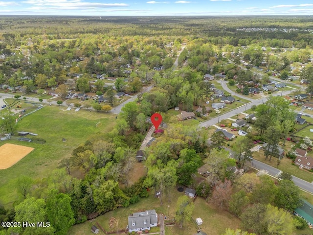 drone / aerial view featuring a forest view