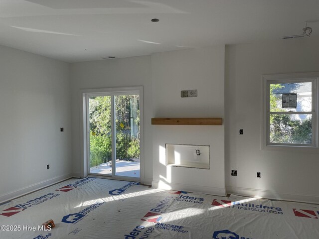 730 S Bennett St Unit 244, Southern Pines, NC 28387 - unfurnished living room with baseboards