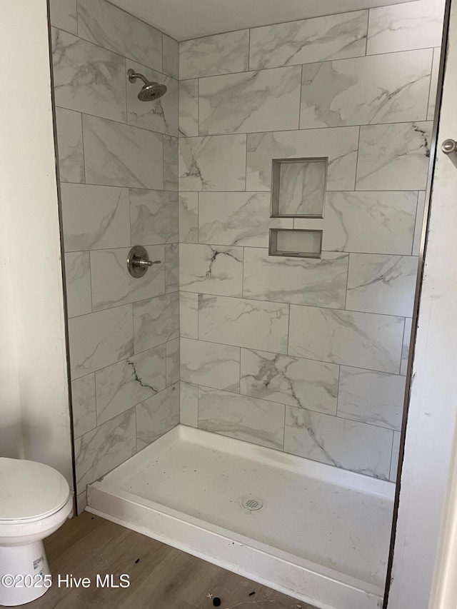 730 S Bennett St Unit 244, Southern Pines, NC 28387 - full bathroom with wood finished floors, a shower stall, and toilet