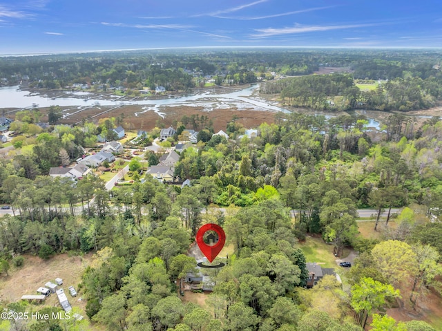 aerial view of property's location featuring a nearby body of water