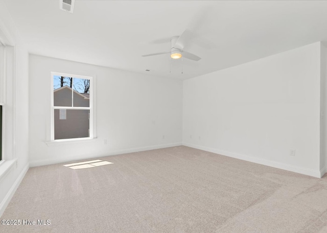 341 Mccabe Rd, Morehead City, NC 28557 - carpeted spare room featuring a ceiling fan, baseboards, and visible vents