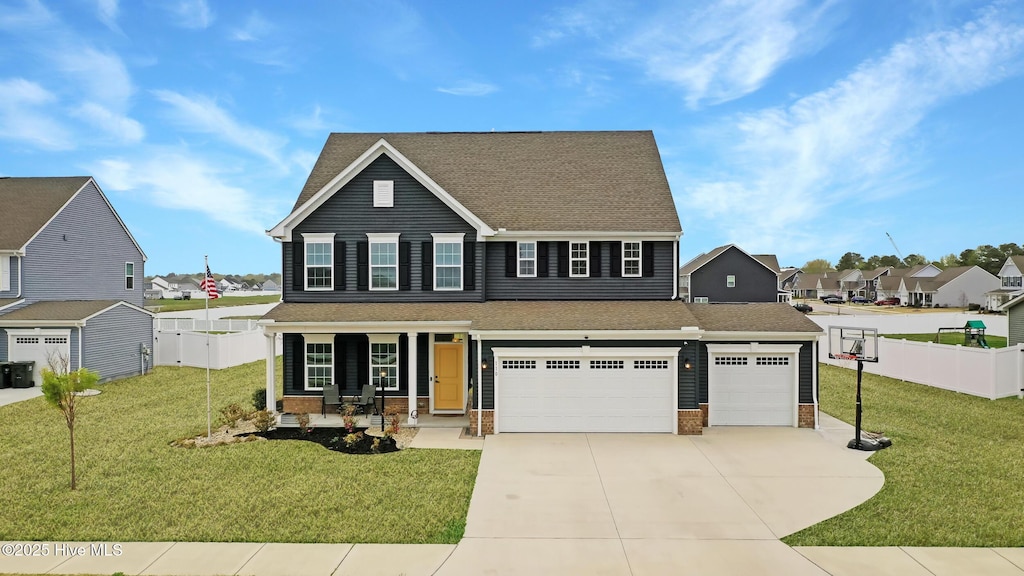 110 Steppeside Ln, Moyock, NC 27958 - traditional-style home with fence, a garage, a front yard, a residential view, and driveway