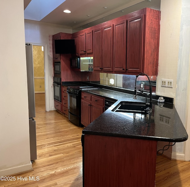 117 Creekview Rd, New Bern, NC 28562 - kitchen with stainless steel fridge, light wood-style flooring, brown cabinetry, and crown molding