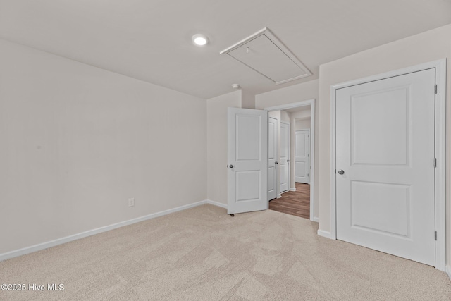 409 King Creek Dr, Havelock, NC 28532 - unfurnished bedroom with light carpet, attic access, and recessed lighting