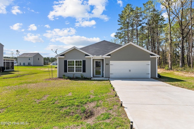 409 King Creek Dr, Havelock, NC 28532 - view of front of home with a garage, concrete driveway, and a front yard