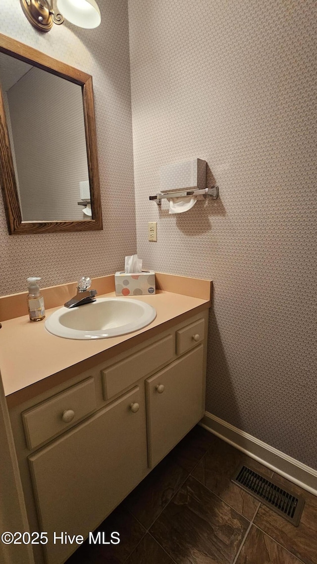 112 Reynard Path, Clinton, NC 28328 - bathroom featuring wallpapered walls, vanity, baseboards, and visible vents