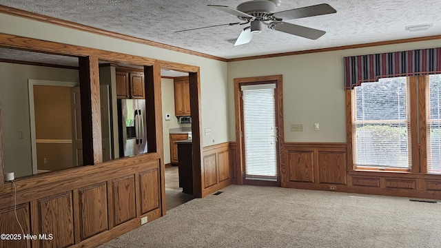 112 Reynard Path, Clinton, NC 28328 - kitchen featuring stainless steel fridge with ice dispenser, plenty of natural light, wainscoting, and carpet floors