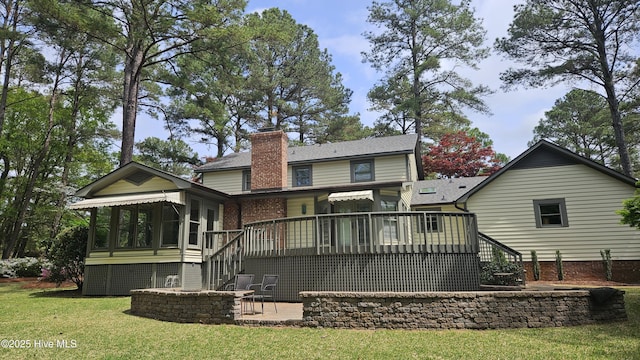 112 Reynard Path, Clinton, NC 28328 - rear view of property with a sunroom, a yard, a patio, a chimney, and a deck