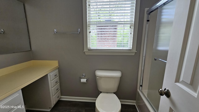 112 Reynard Path, Clinton, NC 28328 - bathroom with toilet, vanity, baseboards, and bath / shower combo with glass door