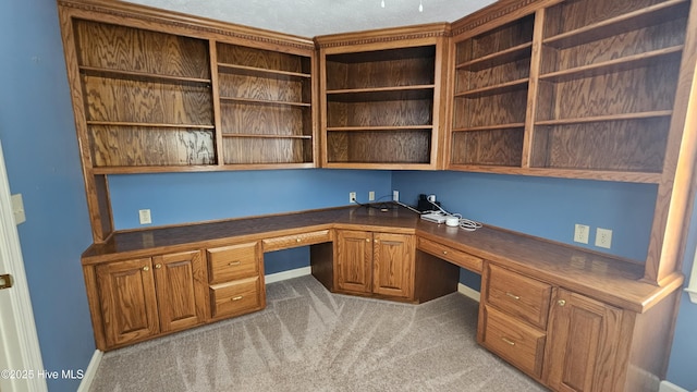 112 Reynard Path, Clinton, NC 28328 - unfurnished office featuring built in desk, baseboards, and light carpet
