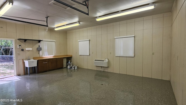 112 Reynard Path, Clinton, NC 28328 - garage with a wall mounted air conditioner and a sink