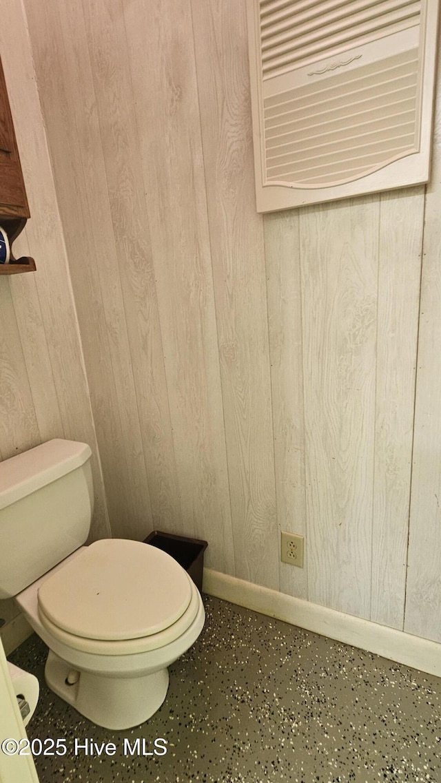 112 Reynard Path, Clinton, NC 28328 - bathroom featuring wooden walls, toilet, and baseboards