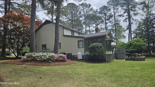 112 Reynard Path, Clinton, NC 28328 - view of property exterior with cooling unit, a chimney, and a lawn