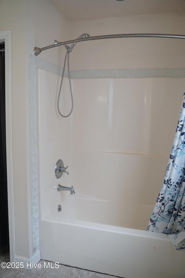 bathroom featuring tile patterned floors and shower / tub combo
