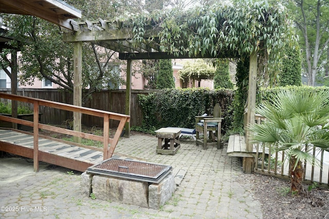 exterior space featuring fence and a pergola