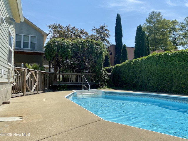 view of swimming pool featuring a fenced in pool