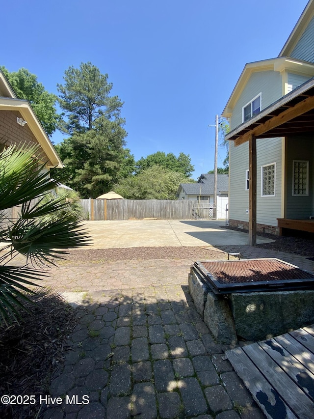 view of yard featuring a patio and a fenced backyard