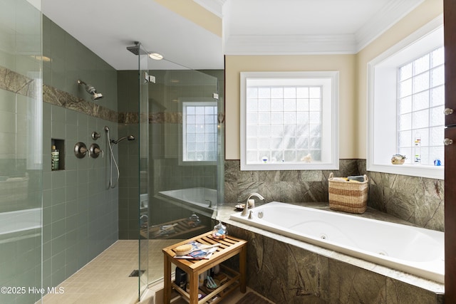full bathroom with a stall shower, a jetted tub, and crown molding