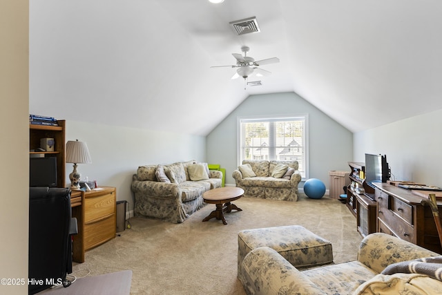 carpeted living area with visible vents, ceiling fan, and vaulted ceiling