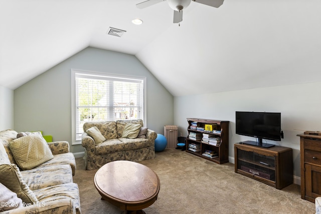 living area featuring ceiling fan, visible vents, light colored carpet, and lofted ceiling