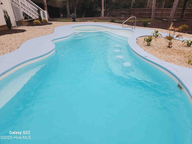 view of pool with fence and a fenced in pool