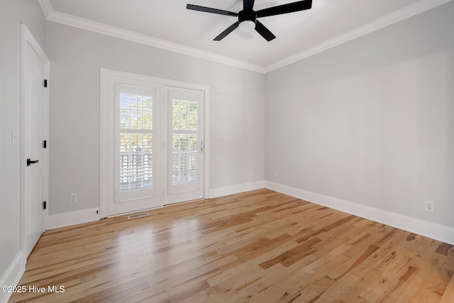 unfurnished room with crown molding, light wood finished floors, baseboards, and ceiling fan