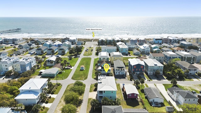 aerial view of residential area with a nearby body of water