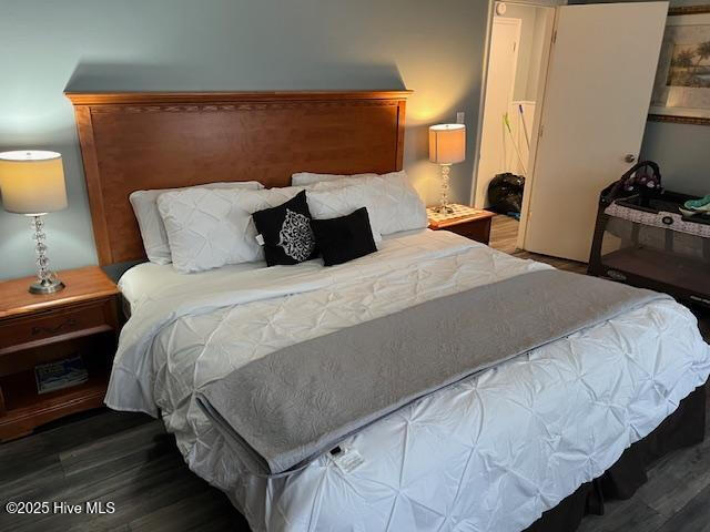 bedroom with wood finished floors