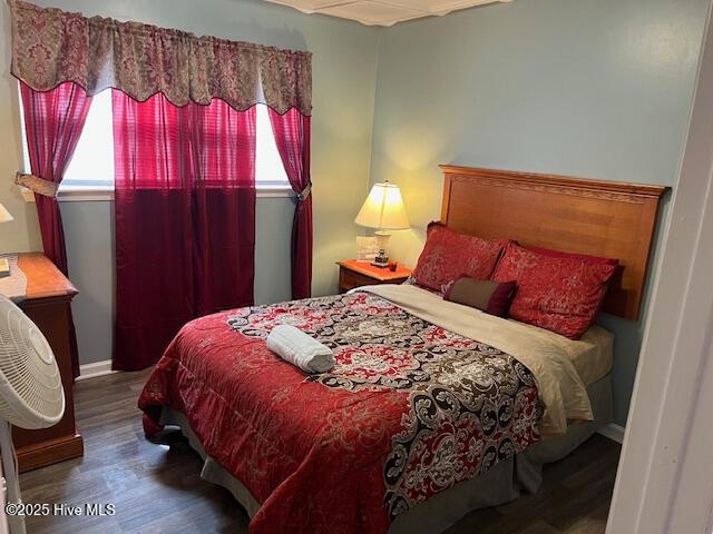 bedroom with wood finished floors