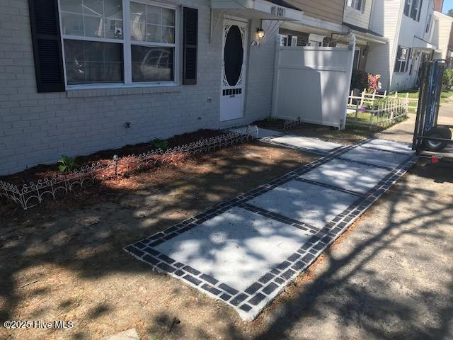 doorway to property with brick siding
