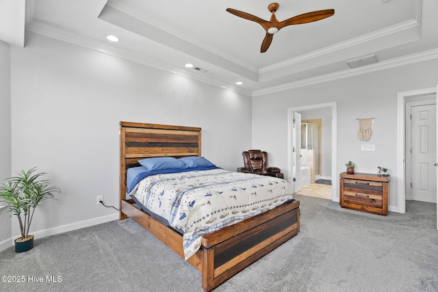 bedroom with crown molding, a tray ceiling, recessed lighting, and carpet flooring