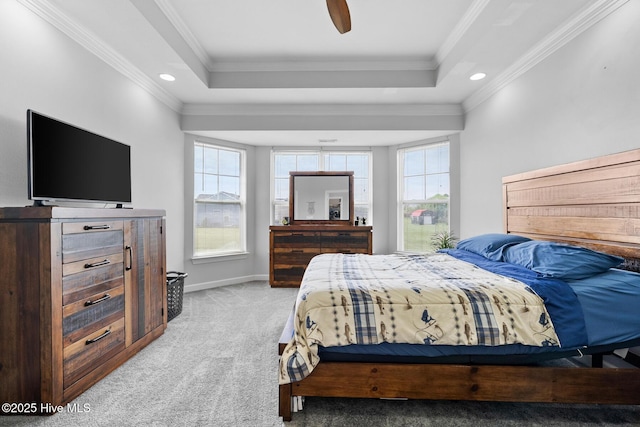 carpeted bedroom featuring ornamental molding, baseboards, a raised ceiling, and recessed lighting