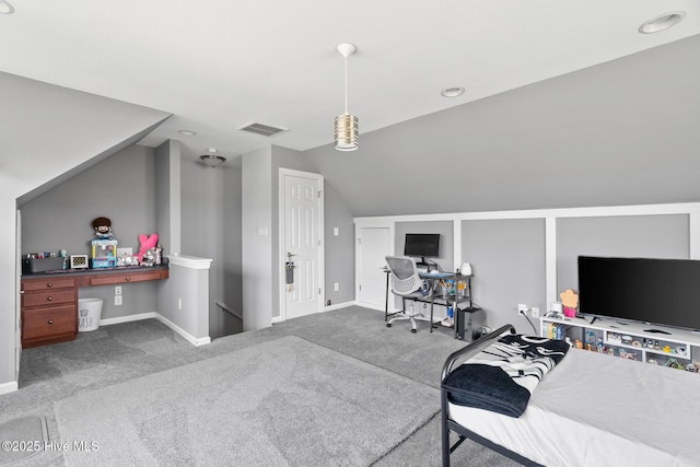 carpeted bedroom with baseboards, vaulted ceiling, and visible vents