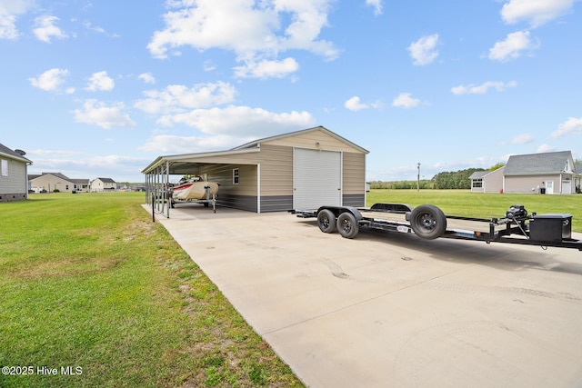 view of outdoor structure featuring driveway and an outdoor structure