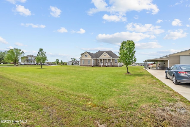 view of front facade featuring a front yard and a carport